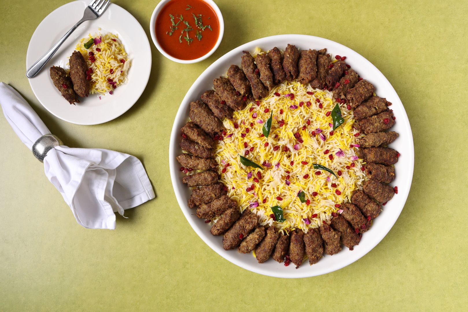 Kebab served on saffron rice