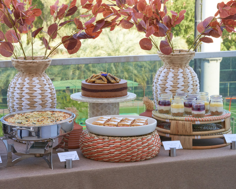 A buffet on a terrace overlooking a garden